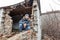 A boy in a ruined house, a teenager was left homeless as a result of military conflicts and natural disasters