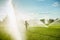 Boy running around the golf courses, which are watered with fountains