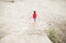 Boy running barefoot at the beach