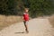 Boy running on dusty road