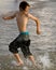 Boy Running with Tide