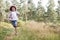 Boy Running Through Woods