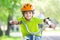 The boy in a safety helmet rides a bicycle