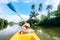 Boy sailing in canoe boat on tropical lagoon