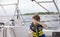 Boy sailing pulling ropes to adjust sails on sailboat