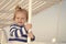 Boy sailor travelling sea. Child cute sailor enjoy journey on cruise liner. Kid adorable striped shirt yacht travel