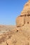 A boy in the sandstone mountains in the Negev