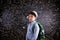 Boy with schoolbag against big blackboard with mathematical sym