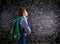 Boy with schoolbag against big blackboard with mathematical sym