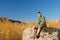 Boy Scout on Large Rock at the Camp Area