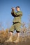 Boy Scout Looking at Compass to Navigate the Trail