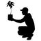 Boy scout with plant bag silhouette vector