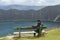 Boy, seat, Quilotoa crater, lagoon, emerald