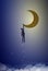 Boy shadow or silhouette holds moon, man hanging on the moon, life in dreams concept, dream story concept,