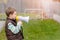 Boy shouts something into the megaphone