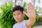 Boy showing open palm stop hand signal