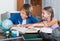 Boy and sister studying with books