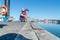 Boy sits on dock fishing