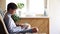 The boy sits on the floor in his room and uses a smartphone. Modern technology in the life of children concept