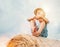 Boy sits on the haystack top with sunny sky background