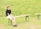 Boy sitting on bench