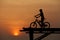 A boy sitting on bicycle