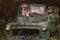 Boy sitting on broken truck