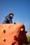 Boy sitting on a climb wall