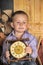 Boy sitting holding clocks in the hands of a waiting midnight