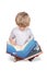 Boy sitting reading a big picture book