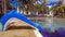 Boy sitting on slide near pool