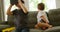 Boy sitting on sofa while brother using virtual reality headset 4k