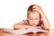 Boy sitting at table fell asleep on exercise book isolated.