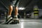 Boy on skateboard skates in undeground parking close up image