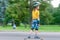 Boy skateboarding on natural background