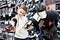 Boy with skates in hockey equipment store