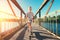 Boy skates on skate board on the bridge over tthe river