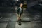 Boy skates on skateboard in undeground parking