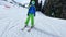 Boy skier racing fast downhill on alpine ski resort