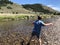 Boy Skipping Rocks on the Salmon River in the Sawtooth National Forest Recreation Area