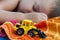 Boy sleeps with bulldozer toy