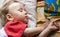 Boy sleeps on varicoloured pillows