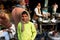 Boy smiling in the crowded indian outdoor cafe