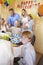 Boy Smiling With Family Having A Retirement Party