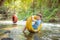 Boy smiling while palying in the river