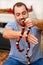 Boy with snakes. Man holds in hands reptile Milk snake Lampropeltis triangulum Arizona kind of snake.