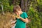 Boy sniffing cashew fruit. Hand harvesting Cashew fruit cashew apple in hand