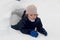 Boy in snow igloo