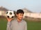 Boy with soccer ball outside