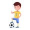 Boy soccer player standing with foot on a ball